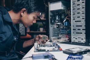 man repairing computer resized
